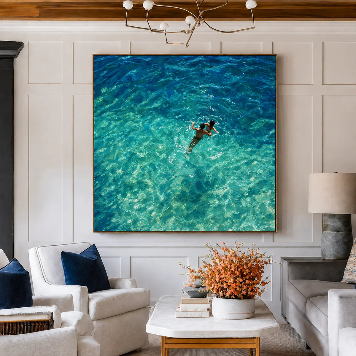 Two Swimmers in Sunlit Turquoise Water Wall Art styled interior scene 2 | Olyrel