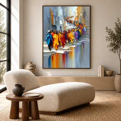 Framed city parade wall art above a curved cream sofa in a neutral living room with a tall window.