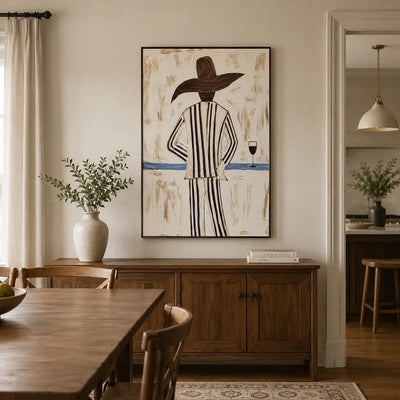 Sun Hat Figure Wall Art displayed above a sofa in a neutral interior | Olyrel