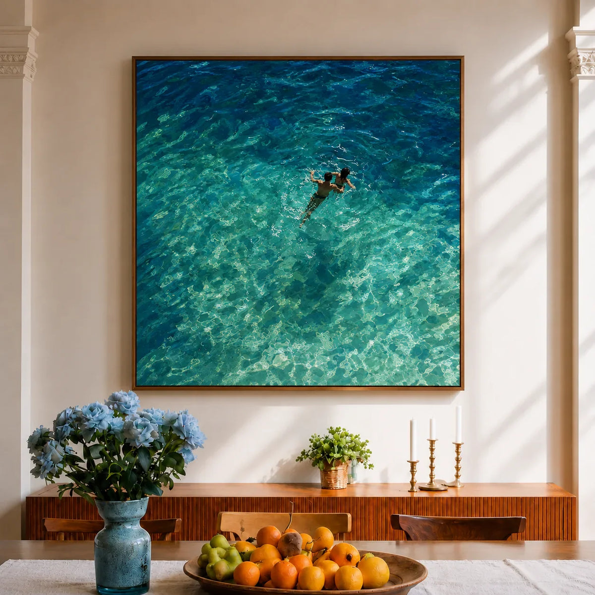 Two Swimmers in Sunlit Turquoise Water Wall Art styled interior scene 5 | Olyrel