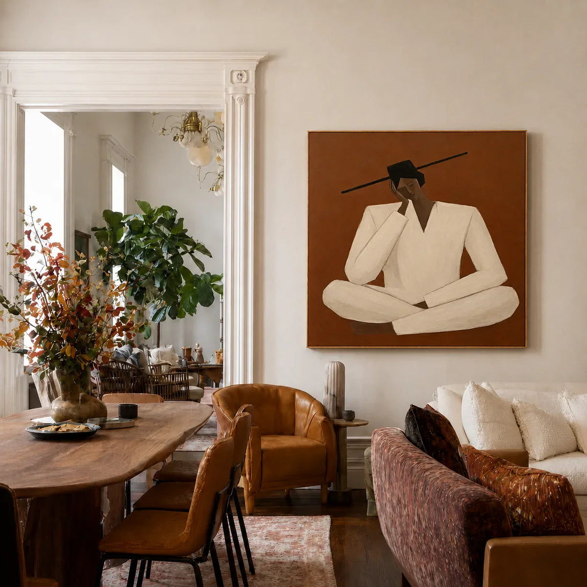 Quiet Cross-Legged Figure in Cream on Burnt Ochre Wall Art styled interior scene 3 | Olyrel