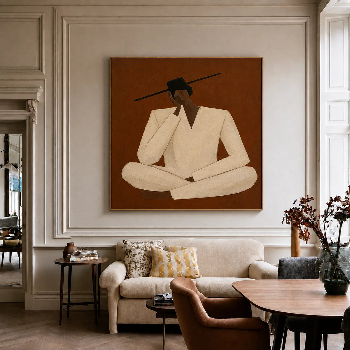 Quiet Cross-Legged Figure in Cream on Burnt Ochre Wall Art styled interior scene 5 | Olyrel